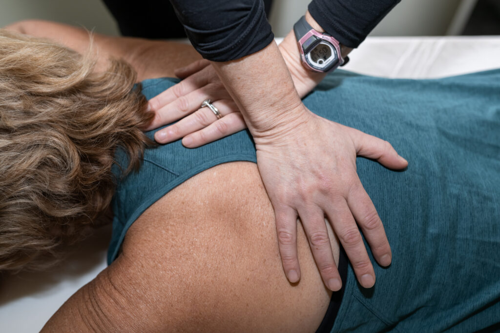 Physical Therapist working with a patient